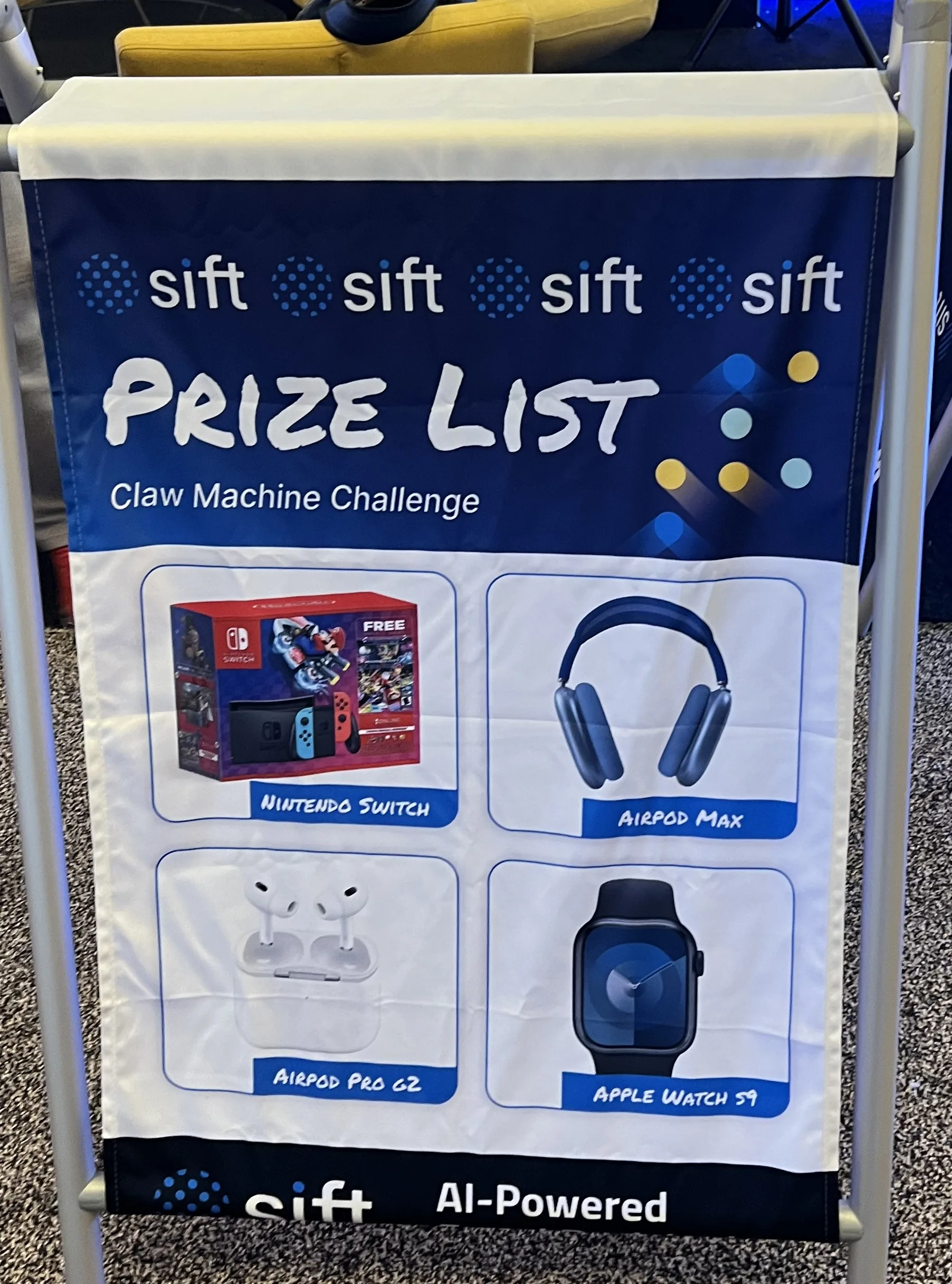 Sift prize list banner for the claw machine challenge showing AirPods Max, Apple Watch, Nintendo Switch and AirPods Pro.
